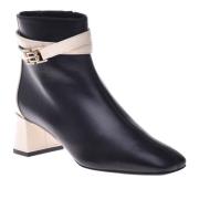 Ankle boots in vanilla and black leather