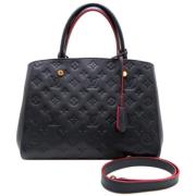 Pre-owned Fabric handbags