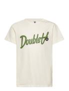 Ola Kids Script & Badge T-Shirt Tops T-shirts Short-sleeved Cream Wood...