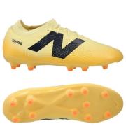 New Balance Tekela V4 Magique FG Energy Rush - Pergament/Svart/Oransje